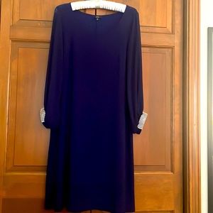 Royal blue sheath dress with rhinestone embellishment.